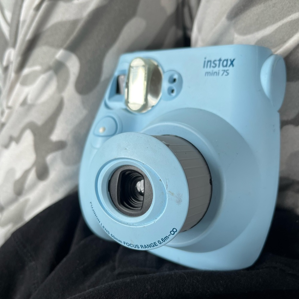 This is a Instax Mini 7S. Light blue and still in excellent condition